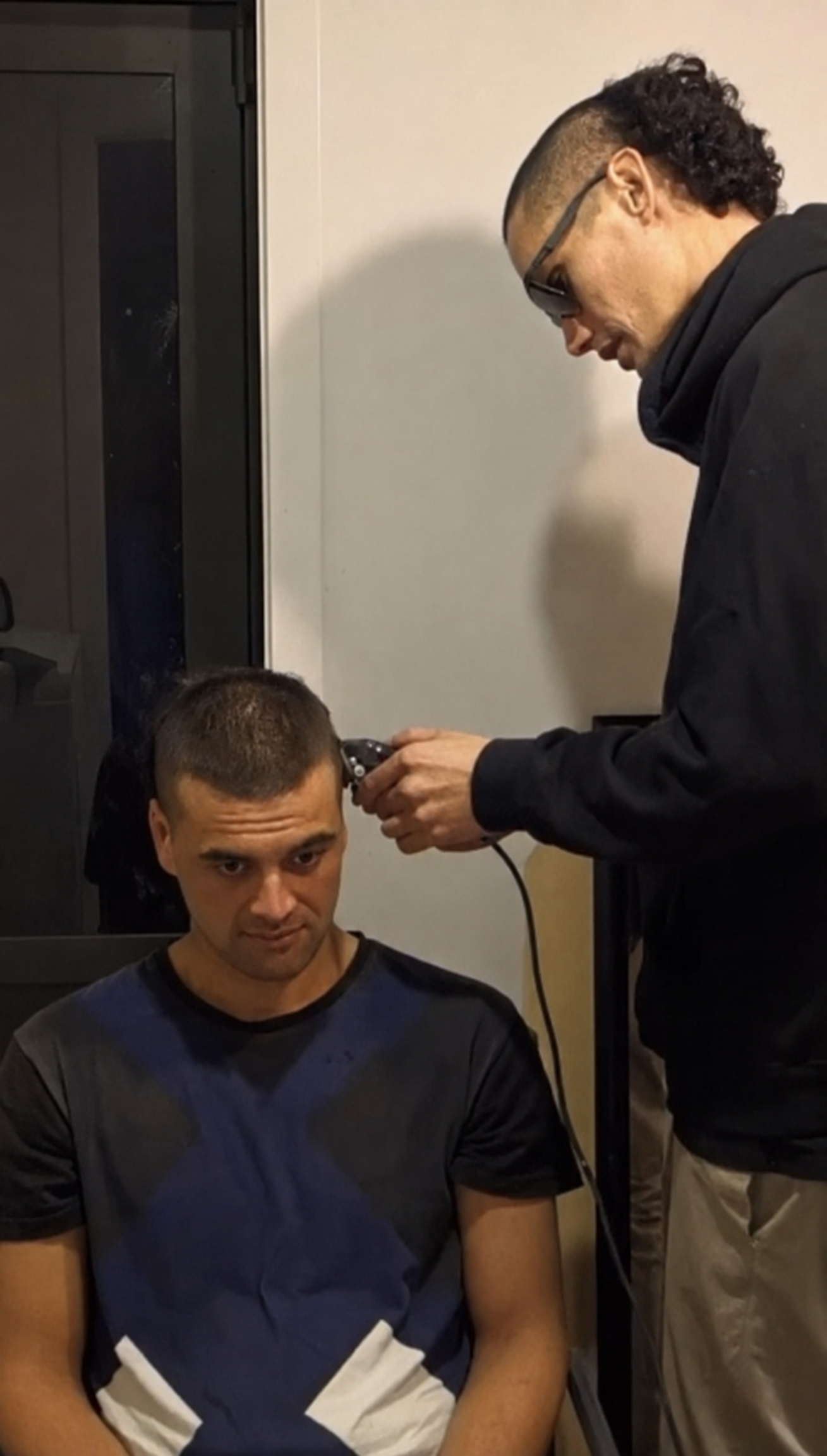 Jabez giving his brother Zeke his first haircut